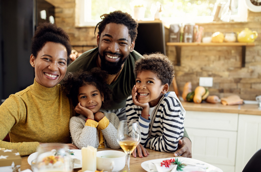 Family enjoying at the dining table wear winter clothes