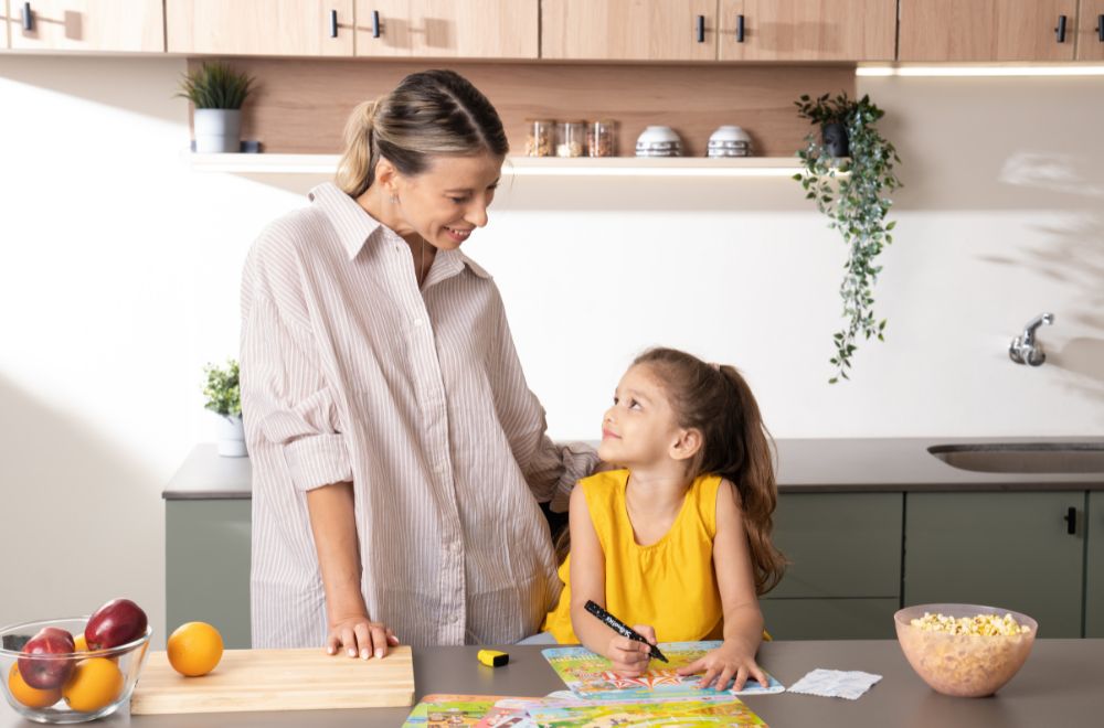 Mother and daughter making mother's day card to celebrate