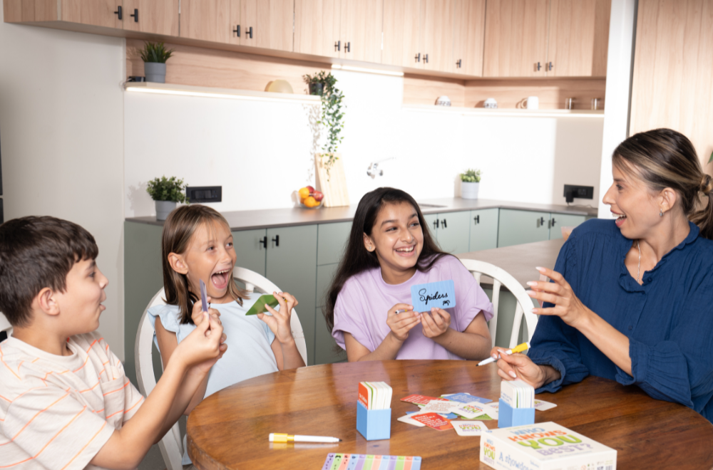 Group of kids and adult playing games from Skillmatics