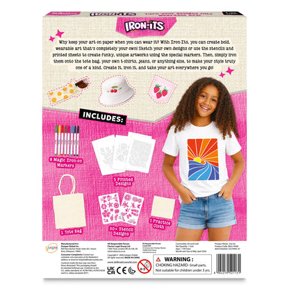 Skillmatics Iron-Its box back panel. Smiling girl wears white tee with colorful sunset iron-on print. Kit includes 8 iron-on markers, 5 printed designs, canvas tote bag, 30-plus stencil designs, and practice cloth. Inset images show orange-print pouch, cherry bucket hat, and strawberry fabric patch.