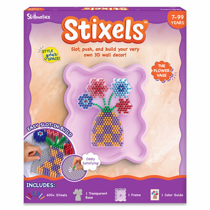 Skillmatics Stixels Flower Vase craft kit box for ages 7–99, featuring a completed 3D flower vase design made with colorful slot-in Stixels. Packaging highlights “Style Your Space,” easy slot-in build, 400+ Stixels, transparent base, frame, color guide, and wall décor display concept.