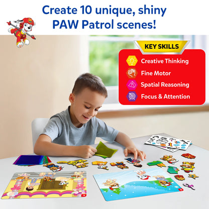 Young boy creating with Paw Patrol-themed stickers and scene boards for creative play