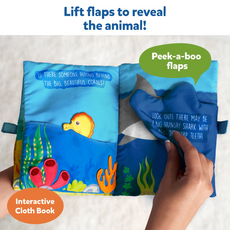 Interactive cloth book with peek-a-boo flaps featuring underwater animals for babies 6 months+