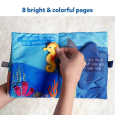 Interactive ocean-themed fabric book for babies featuring underwater animals