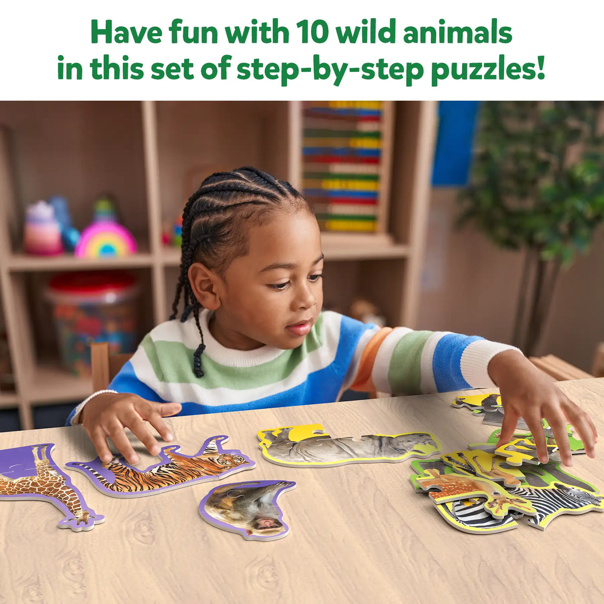 Child playing with wild animals puzzle from Step By Step Puzzle Wild Animals for ages 3+