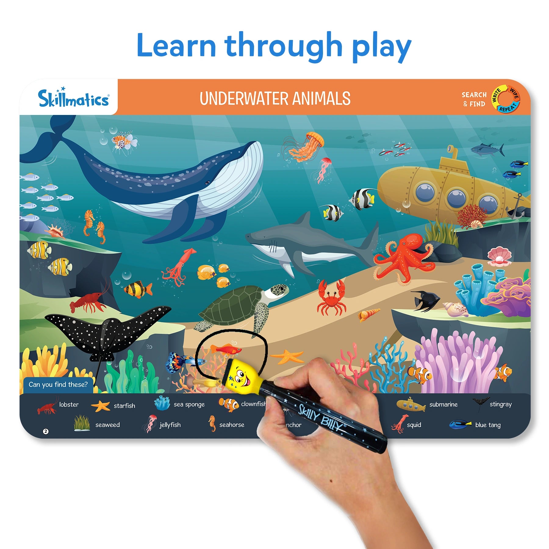 Skillmatics underwater animals learning board with a hand holding a pen.
