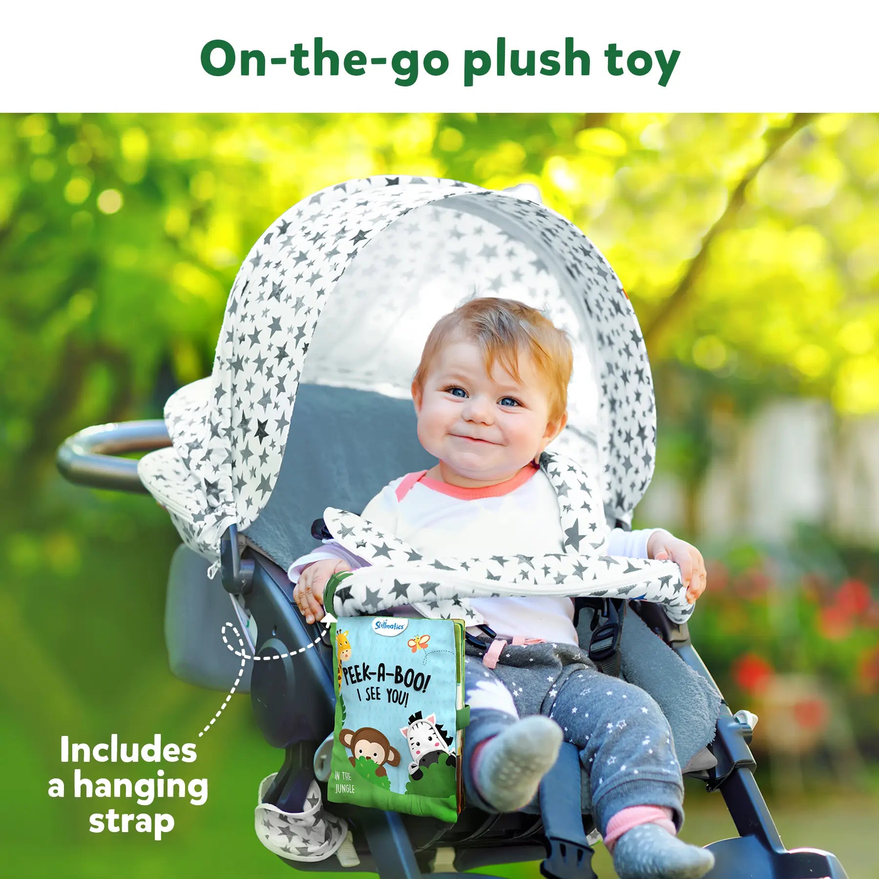 Baby in stroller with hanging jungle-themed interactive soft cloth book for 6 months+
