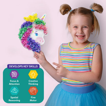 Smiling girl holding a colorful unicorn craft from Poke-in Art Magical Unicorn Dream Decor