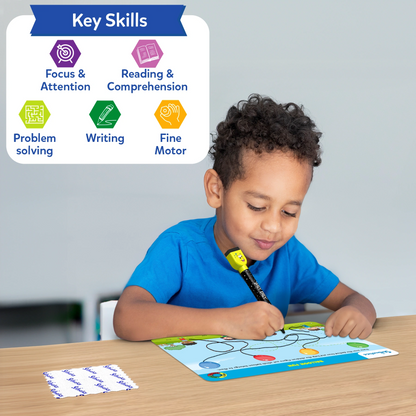 Young boy writing on Skillmatics I Can Write mat with included marker. Key skills highlighted: focus & attention, reading & comprehension, problem solving, writing, and fine motor development.
