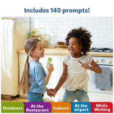 Two girls playing with prompt cards from the Found it Megapack Smart Scavenger Hunt