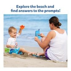 Child and adult playing with toys at the beach for Found It At the Beach scavenger hunt