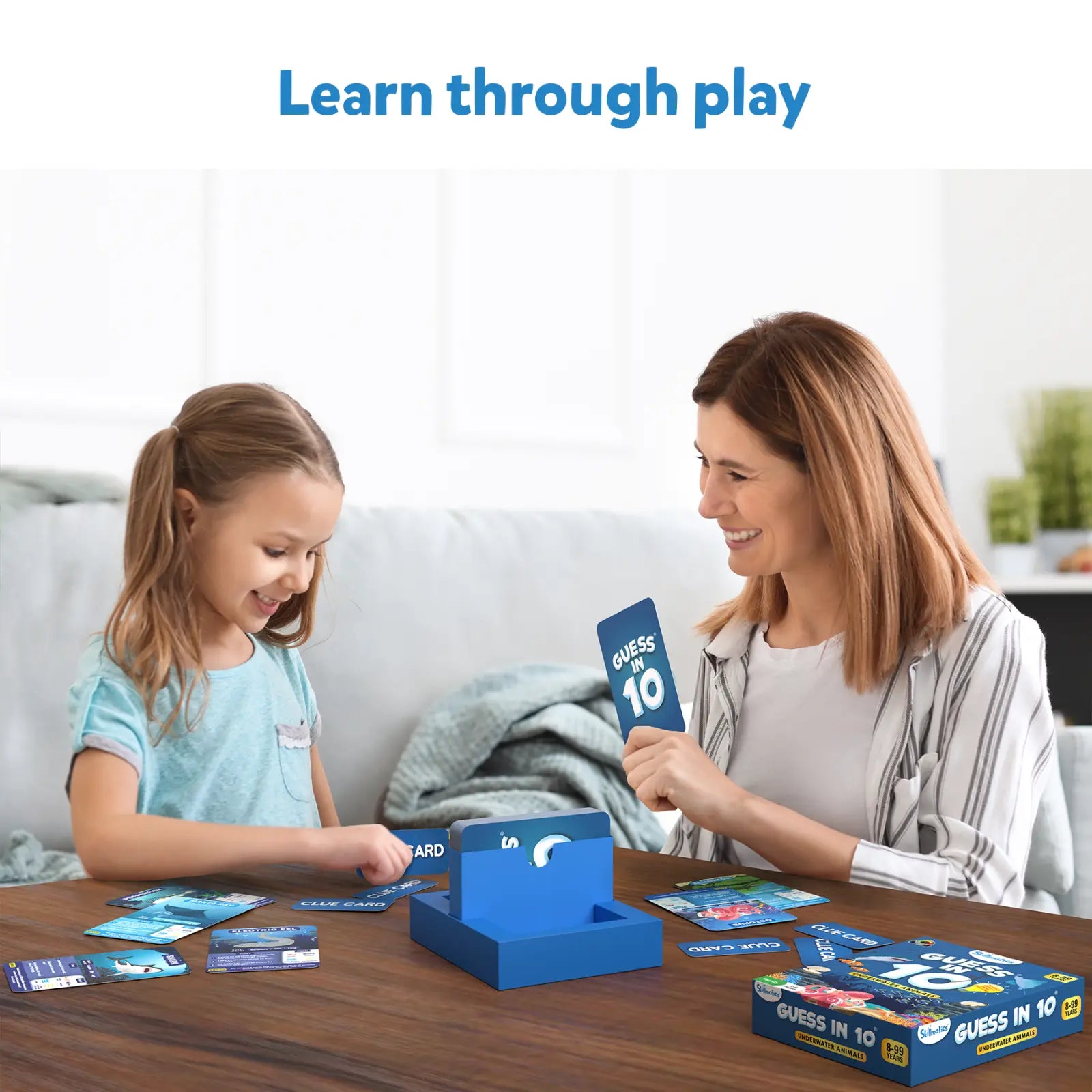 Guess in 10 Underwater Animals trivia card game with cards and a blue box for ages 8+
