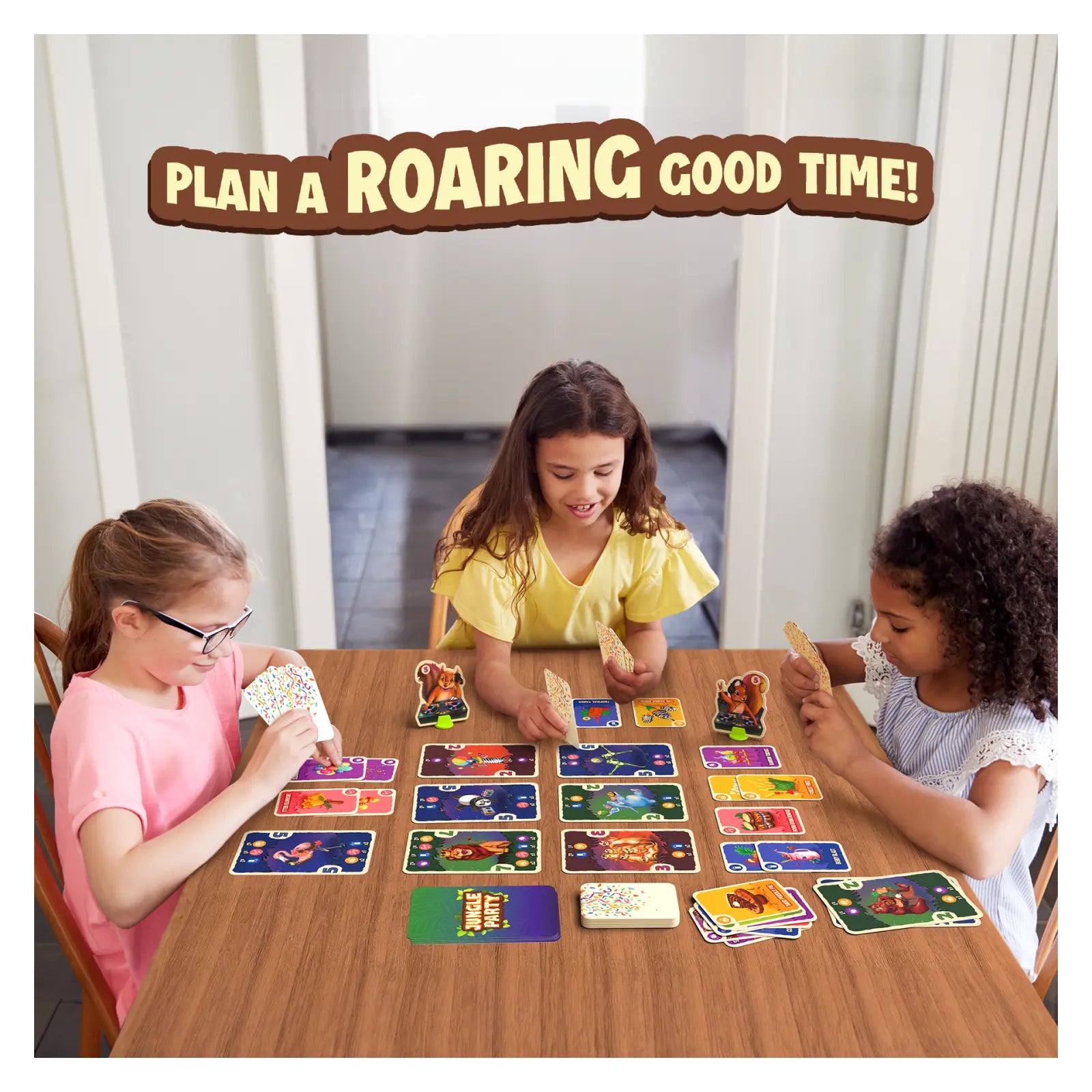 Children enjoying Jungle Party card game of strategy and luck during a fun party