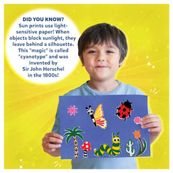 Child holding a sun print craft from Magical Sun Art Sun Paper Art Kit