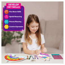 Craft kit for children featuring colorful strings and unicorn-themed art supplies