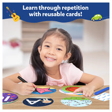 Smiling girl using reusable learning cards from Write and Learn! for toddlers aged 3-6