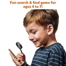 Boy with magnifying glass examining object from Pack Party Favors Can You Spy for ages 4-7